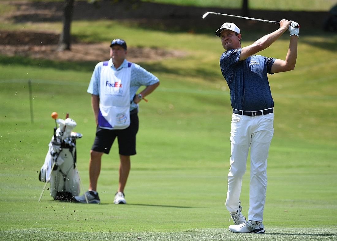 Aug 5, 2021; Memphis, Tennessee, USA; Harris English hits his second shot on the 15th hole during the first round of the WGC FedEx St. Jude Invitational golf tournament at TPC Southwind. Mandatory Credit: Christopher Hanewinckel-USA TODAY Sports