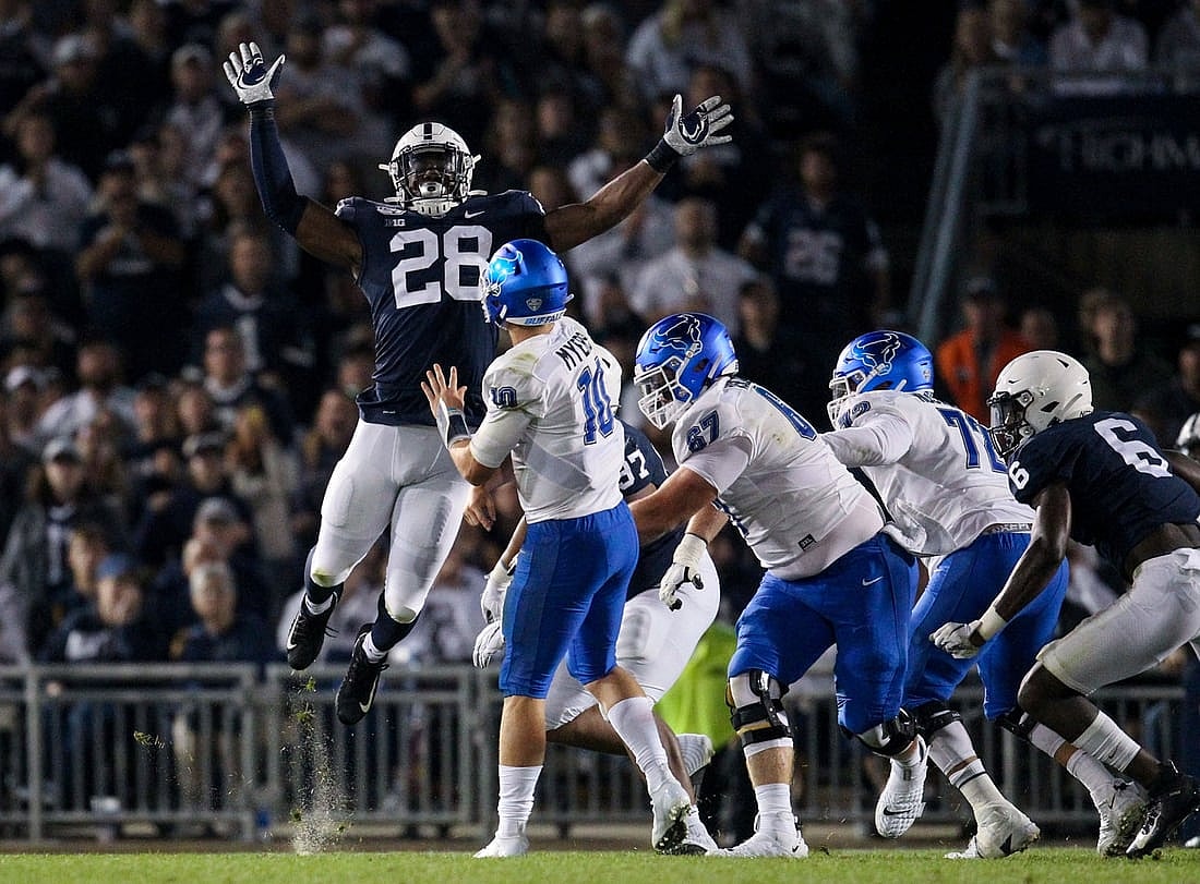 Sep 7, 2019; University Park, PA, USA; Penn State Nittany Lions defensive end Jayson Oweh (28) pressures Buffalo Bulls quarterback Matt Myers (10) during the third quarter at Beaver Stadium. Penn State defeated Buffalo 45-13. Mandatory Credit: Matthew O'Haren-USA TODAY Sports