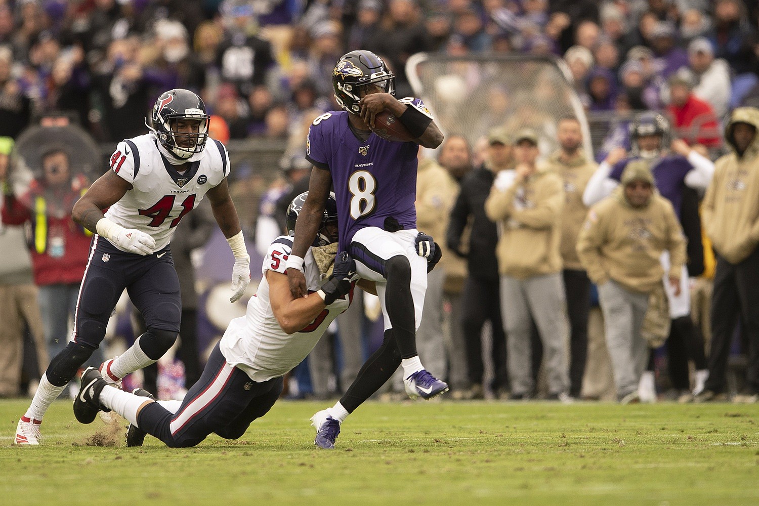 Lamar Jackson evades a tackle