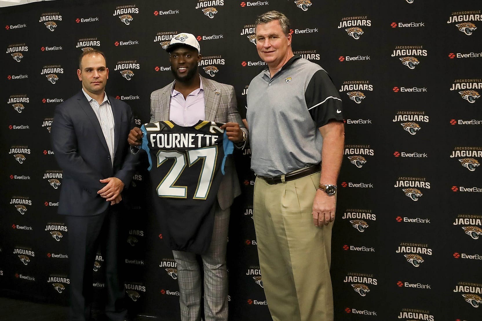 Apr 28, 2017; Jacksonville, FL, USA; Jacksonville Jaguars general manager Dave Caldwell (left), running back Leonard Fournette (center) and head coach Doug Marrone (right) pose for a picture during a press conference at EverBank Field. Leonard Fournette was the 2017 first round pick of the Jacksonville Jaguars. Mandatory Credit: Logan Bowles-USA TODAY Sports