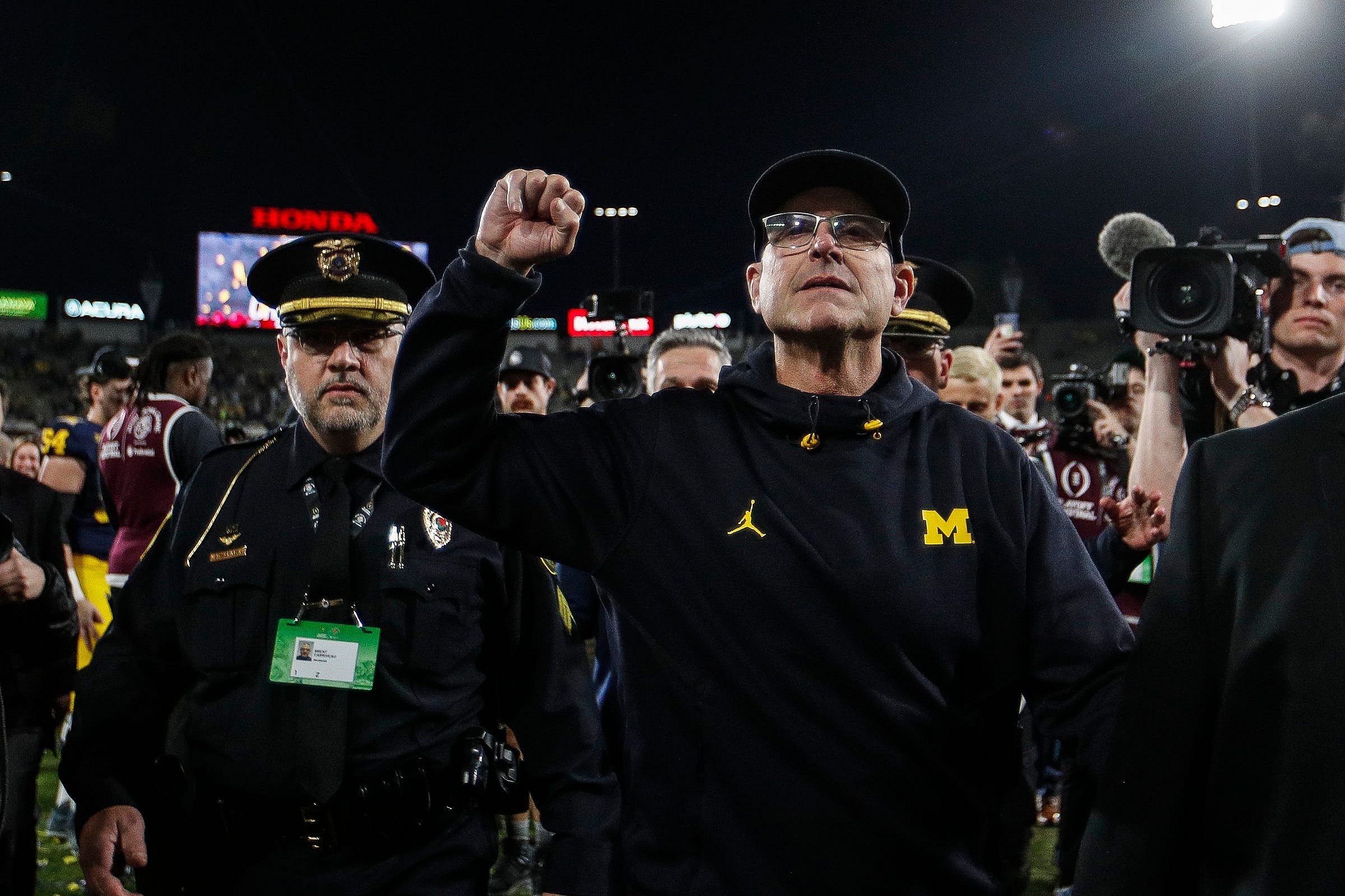 las vegas raiders hire jim harbaugh