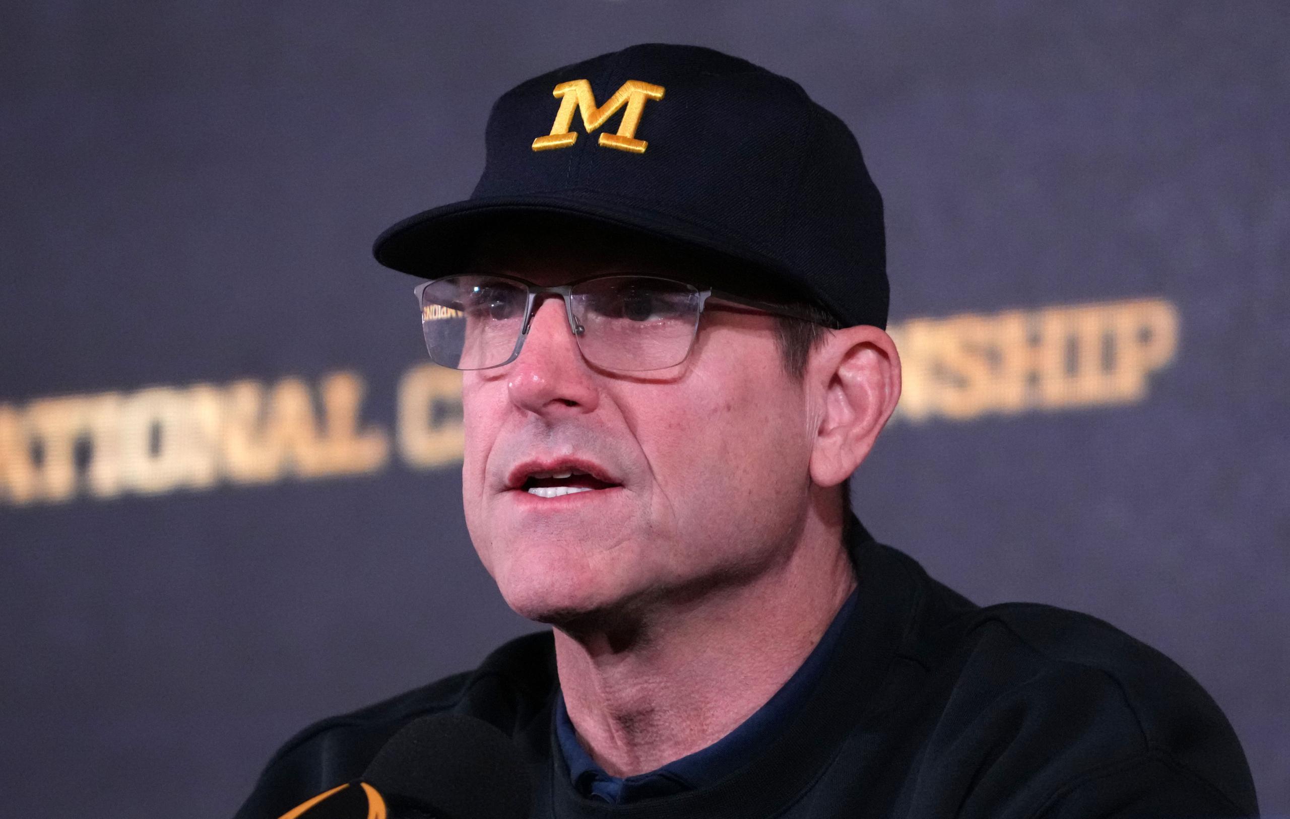 seattle seahawks hire jim harbaugh