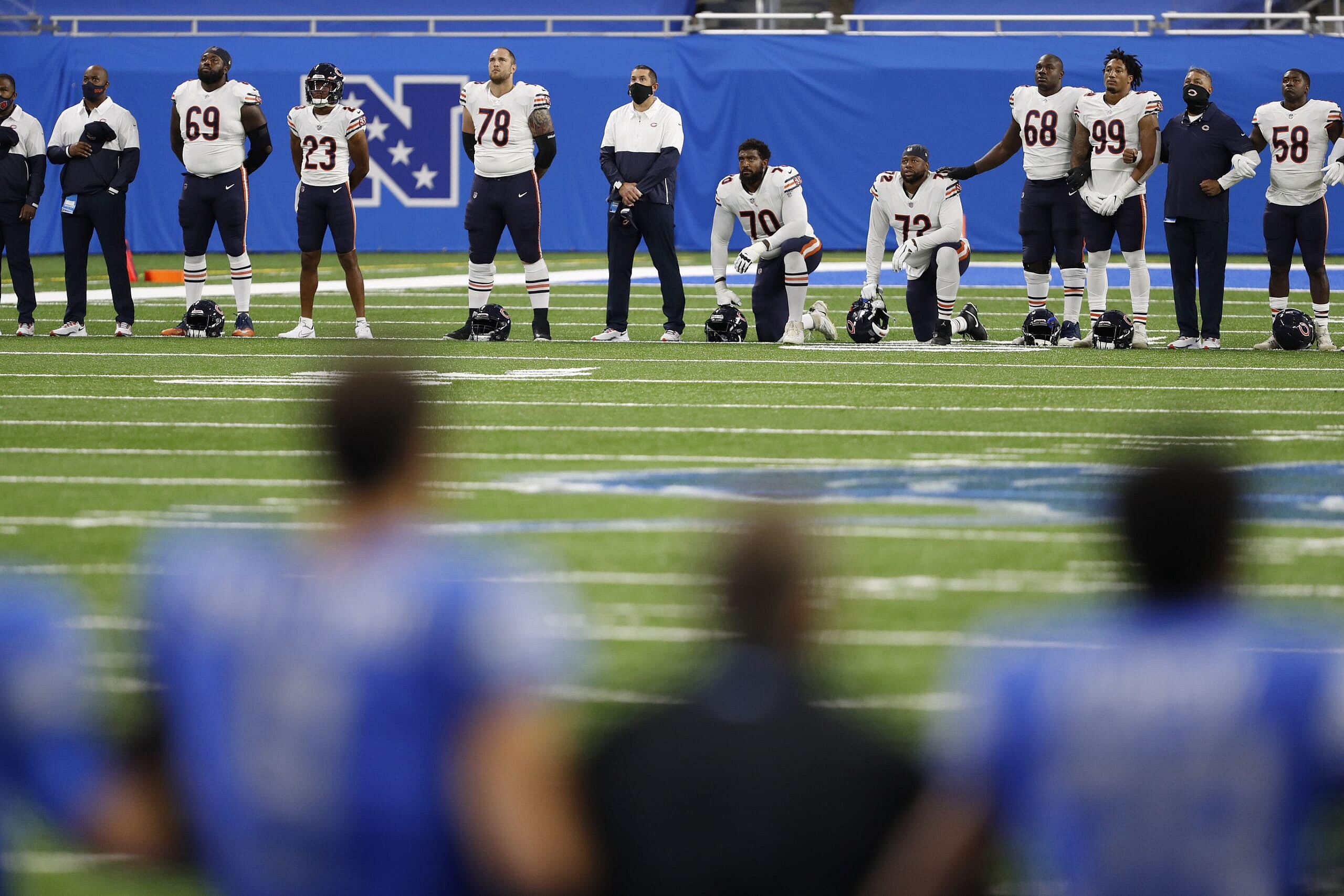 Chicago Bears and Detroit Lions players demonstrate in Week 1