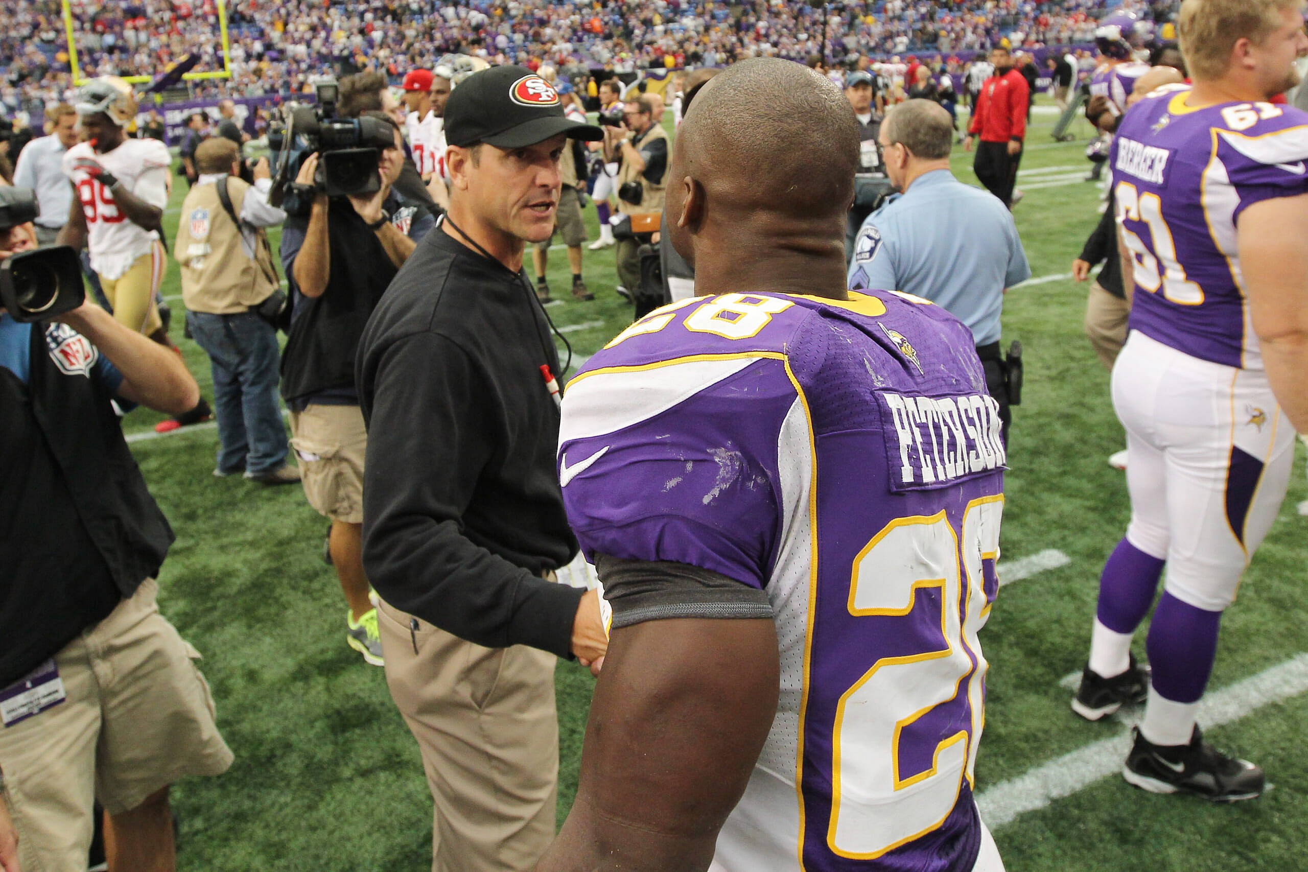 minnesota vikings hire jim harbaugh