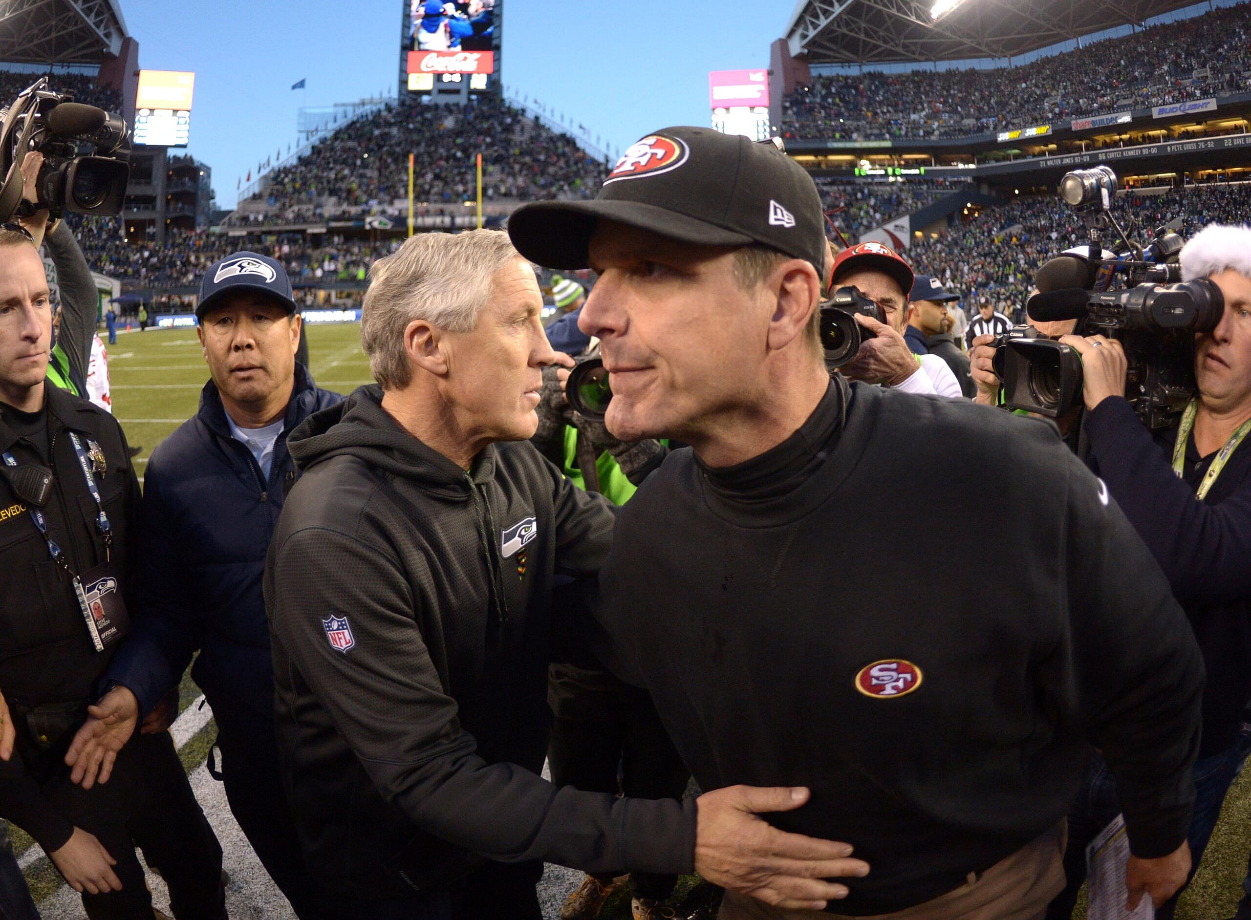 seattle seahawks hire jim harbaugh
