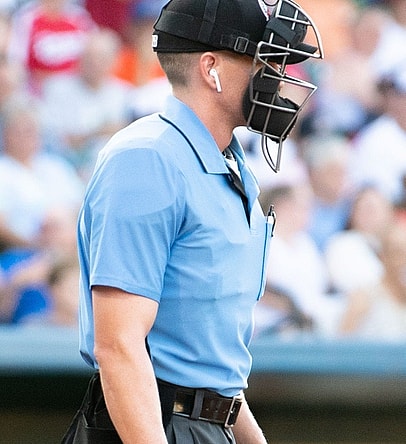 The umpire wears an ear piece to hear the call determined by the TrackMan radar system, July 10, 2019.

Ydr Cc 7 10 19 Trackman