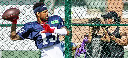 A young fan watches New England Patriots defensive back Jack Jones (13) from behind a fence at Clarke Hinkle Field during a joint practice with the Green Bay Packers in Ashwaubenon, Wis. on Thursday, August 17, 2023. Seeger Gray/USA TODAY NETWORK-Wisconsin