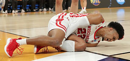 Wisconsin guard Chucky Hepburn (23) writhes in pain after being injured  during the first half in their second round game of the 2022 NCAA Men's Basketball Tournament against Iowa State Sunday, March 20, 2022 at Fiserv Forum in Milwaukee, Wis.

Mjs Uwmen21 1 Jpg Ncaa21