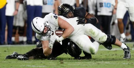 Purdue Boilermakers linebacker Clyde Washington (42) and Purdue Boilermakers safety Chris Jefferson (17) tackle Penn State Nittany Lions tight end Tyler Warren (44) during the NCAA football game, Thursday, Sept. 1, 2022, at Ross-Ade Stadium in West Lafayette, Ind. Penn State won 35-31.

Purduepennstatefb090122 Am01374