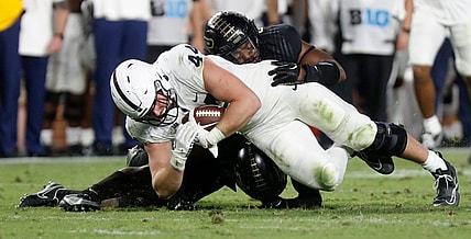 Purdue Boilermakers linebacker Clyde Washington (42) and Purdue Boilermakers safety Chris Jefferson (17) tackle Penn State Nittany Lions tight end Tyler Warren (44) during the NCAA football game, Thursday, Sept. 1, 2022, at Ross-Ade Stadium in West Lafayette, Ind. Penn State won 35-31.

Purduepennstatefb090122 Am01374