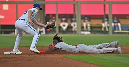 Jun 13, 2023; Kansas City, Missouri, USA;  Cincinnati Reds shortstop Elly De La Cruz (44) steals second base against Kansas City Royals second baseman Matt Duffy (15) in the first inning at Kauffman Stadium. Mandatory Credit: Peter Aiken-USA TODAY Sports