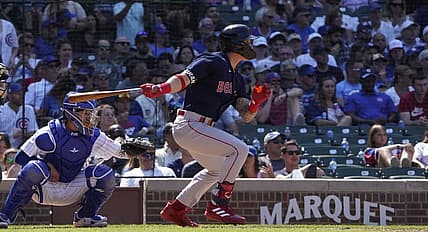 Jul 3, 2022; Chicago, Illinois, USA; Boston Red Sox center fielder Jarren Duran (40) hits a single against the Chicago Cubs during the sixth inning at Wrigley Field. Mandatory Credit: David Banks-USA TODAY Sports