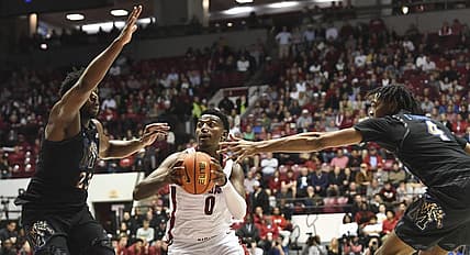 Dec 13, 2022; Tuscaloosa, Alabama, USA; Alabama guard Jaden Bradley (0) drives between Memphis forward Malcolm Dandridge (23) and Memphis forward Chandler Lawson (4) at Coleman Coliseum. Mandatory Credit: Gary Cosby Jr.-USA TODAY Sports