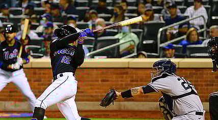 Sep 10, 2021; New York City, New York, USA; New York Mets shortstop Francisco Lindor (12) hits a solo home run against the New York Yankees during the fourth inning at Citi Field. Mandatory Credit: Andy Marlin-USA TODAY Sports