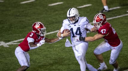 Oct 24, 2020; Bloomington, Indiana, USA;  Penn State Nittany Lions quarterback Sean Clifford (14) attempts to avoid tackle from Indiana Hoosiers linebacker Micah McFadden (47) and Indiana Hoosiers defensive back Tiawan Mullen (3)  late in the second half of the game at Memorial Stadium. The Indiana Hoosiers defeated the Penn State Nittany Lions 36 to 35.  Mandatory Credit: Marc Lebryk-USA TODAY Sports