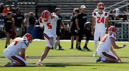 Illinois Fighting Illini punter Hugh Robertson (19) and Illinois Fighting Illini place kicker Caleb Griffin (5) practice kicking ahead of the NCAA football game against the Purdue Boilermakers, Saturday, Sept. 30, 2023, at Ross-Ade Stadium in West Lafayette, Ind.