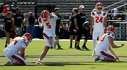 Illinois Fighting Illini punter Hugh Robertson (19) and Illinois Fighting Illini place kicker Caleb Griffin (5) practice kicking ahead of the NCAA football game against the Purdue Boilermakers, Saturday, Sept. 30, 2023, at Ross-Ade Stadium in West Lafayette, Ind.