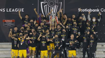 Dec 22, 2020; Orlando, Florida, USA; Tigres players celebrate by lifting the Scotiabank Champions League trophy after defeating Los Angeles FC at the 2020 SCCL final at Exploria Stadium. Mandatory Credit: Reinhold Matay-USA TODAY Sports