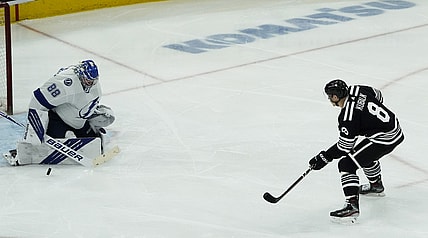 Apr 27, 2021; Chicago, Illinois, USA; Tampa Bay Lightning goaltender Andrei Vasilevskiy (88) makes a save on Chicago Blackhawks left wing Dominik Kubalik (8) during the third period at United Center. Mandatory Credit: David Banks-USA TODAY Sports