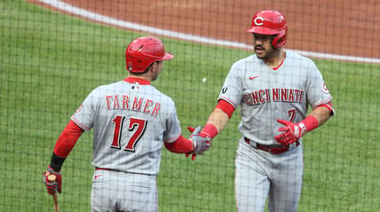 May 10, 2021; Pittsburgh, Pennsylvania, USA; Cincinnati Reds shortstop Kyle Farmer (17) congratulates first  baseman Mike Moustakas (9) on his solo home run against the Pittsburgh Pirates during the second inning at PNC Park. Mandatory Credit: Charles LeClaire-USA TODAY Sports