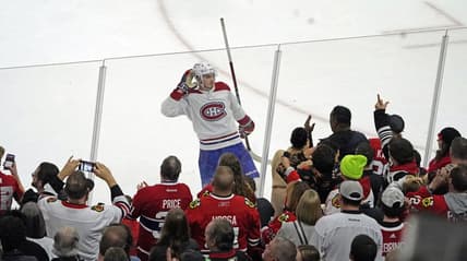 Nov 25, 2022; Chicago, Illinois, USA; Montreal Canadiens center Kirby Dach (77) celebrates the game winning goal against the Chicago Blackhawks during a shootout at United Center. Mandatory Credit: David Banks-USA TODAY Sports