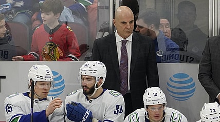 Mar 26, 2023; Chicago, Illinois, USA; Vancouver Canucks head coach Rick Tocchet stands behind the bench during the first period at United Center. Mandatory Credit: David Banks-USA TODAY Sports