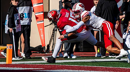 Nov 4, 2023; Bloomington, Indiana, USA; Indiana's Brendan Sorsby (15) scores a touchdown during the first half against Wisconsin at Memorial Stadium. Mandatory Credit: Rich Janzaruk-USA TODAY Sports