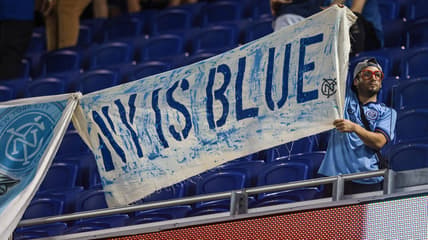 Aug 21, 2021; Harrison, New Jersey, USA; A fan displays a banner during a weather delay before a match between the New York Red Bulls and New York City FC at Red Bull Arena. Mandatory Credit: Vincent Carchietta-USA TODAY Sports
