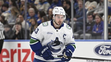 Vancouver Canucks' Quinn Hughes (43) in action against the St. Louis Blues during the second period of an NHL hockey game Monday, Jan. 27, 2025, in St. Louis. (AP Photo/Joe Puetz)