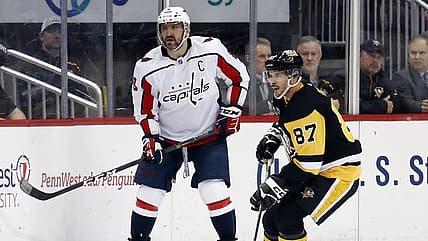 Mar 25, 2023; Pittsburgh, Pennsylvania, USA;  Washington Capitals left wing Alex Ovechkin (8) and Pittsburgh Penguins center Sidney Crosby (87) look for the puck during the third period at PPG Paints Arena. Pittsburgh won 4-3. Mandatory Credit: Charles LeClaire-USA TODAY Sports
