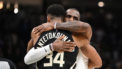 Dec 2, 2022; Milwaukee, Wisconsin, USA; Los Angeles Lakers forward LeBron James (6) and Milwaukee Bucks forward Giannis Antetokounmpo (34) exchange hugs after the Los Angeles Lakers 133-129 win over the Milwaukee Bucks at Fiserv Forum. Mandatory Credit: Michael McLoone-USA TODAY Sports