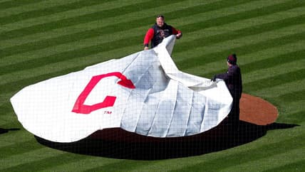 Members of the Cleveland Guardians grounds crew pulls the tarp over the mound at Progressive Field, Thursday, March 30, 2023, in Cleveland, Ohio.

Guardians Preview 6