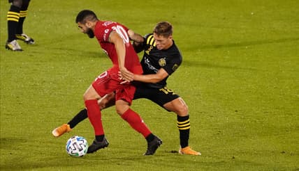 Sep 27, 2020; Hartford, CT, Hartford, CT, USA; Toronto FC midfielder Alejandro Pozuelo (10) works the ball against Columbus Crew midfielder Sebastian Berhalter (18) in the first half at Pratt & Whitney Stadium at Rentschler Field. Mandatory Credit: David Butler II-USA TODAY Sports