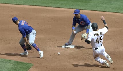 Apr 11, 2021; Pittsburgh, Pennsylvania, USA;  Chicago Cubs second baseman Eric Sogard (4) flips the ball between his legs to shortstop Javier Baez (9) for a forceout of Pittsburgh Pirates center fielder Dustin Fowler (49) at second base during the third inning at PNC Park. Mandatory Credit: Charles LeClaire-USA TODAY Sports