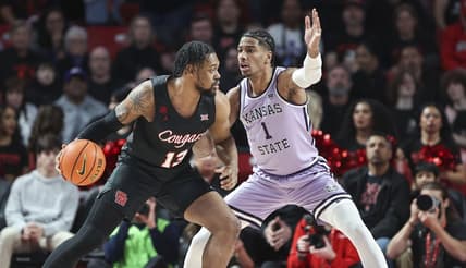 Jan 27, 2024; Houston, Texas, USA; Houston Cougars forward J'Wan Roberts (13) controls the ball as Kansas State Wildcats forward David N'Guessan (1) defends during the first half at Fertitta Center. Mandatory Credit: Troy Taormina-USA TODAY Sports
