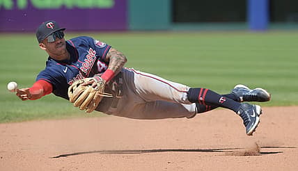 Jun 30, 2022; Cleveland, Ohio, USA; Minnesota Twins shortstop Carlos Correa (4) throws to third after fielding a ball hit by Cleveland Guardians center fielder Myles Straw (not pictured) during the eighth inning at Progressive Field. Correa was charged with a throwing error and two runs scored on the play. Mandatory Credit: Ken Blaze-USA TODAY Sports