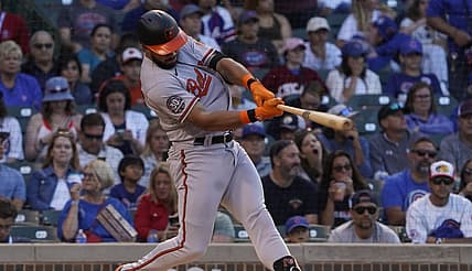 Jul 13, 2022; Chicago, Illinois, USA; Baltimore Orioles left fielder Anthony Santander (25) hits a two RBI double against the Chicago Cubs during the first inning at Wrigley Field. Mandatory Credit: David Banks-USA TODAY Sports