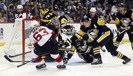 Feb 24, 2022; Pittsburgh, Pennsylvania, USA;  New Jersey Devils left wing Jesper Bratt (63) scores a goal against the Pittsburgh Penguins during the first period at PPG Paints Arena. Mandatory Credit: Charles LeClaire-USA TODAY Sports