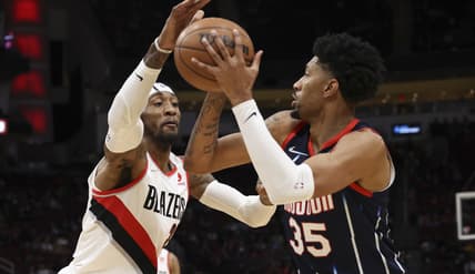 Jan 28, 2022; Houston, Texas, USA; Houston Rockets center Christian Wood (35) shoots against Portland Trail Blazers forward Robert Covington (33) in the first period at Toyota Center. Mandatory Credit: Thomas Shea-USA TODAY Sports