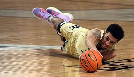 Feb 19, 2022; Nashville, Tennessee, USA; Vanderbilt Commodores guard Scotty Pippen Jr. (2) dives for a loose ball against the Texas A&M Aggies during the first half at Memorial Gymnasium. Mandatory Credit: Christopher Hanewinckel-USA TODAY Sports
