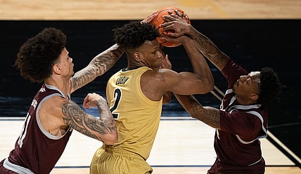 Vanderbilt Commodores forward Ven-Allen Lubin (2) is pressured by Texas A&M Aggies forward Andersson Garcia (11) and guard Wade Taylor IV (4) during their game at Memorial Gym in Nashville, Tenn., Tuesday, Feb. 13, 2024.