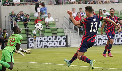 Jul 29, 2021; Austin, Texas, USA; United States forward Matthew Hoppe (13) shoots on goal as Qatar goalkeeper goalkeeper Meshaal Barsham (22) makes the save in the first half of a Concacaf Gold Cup semifinal soccer match at Q2 Stadium. Mandatory Credit: Scott Wachter-USA TODAY Sports
