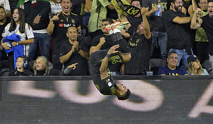 Sep 16, 2023; Los Angeles, California, USA;  Los Angeles FC forward Denis Bouanga (99) celebrates after scoring a goal past Los Angeles Galaxy goalkeeper Jonathan Bond (1) off a pass by Los Angeles Galaxy forward Michael Barrios (12) in the first half at BMO Stadium. Mandatory Credit: Jayne Kamin-Oncea-USA TODAY Sports