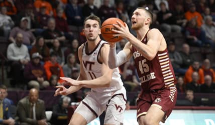 Feb 8, 2023; Blacksburg, Virginia, USA; Boston Colle Eagles guard Mason Madsen (45) drives to basket in front of Virginia Tech Hokies forward John Camden (11) in the first half at Cassell Coliseum. Mandatory Credit: Lee Luther Jr.-USA TODAY Sports