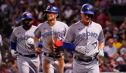 Aug 23, 2022; Boston, Massachusetts, USA; Toronto Blue Jays third baseman Matt Chapman (26), first baseman Cavan Biggio (8) and right fielder Jackie Bradley Jr. (25) scored on a triple by center fielder George Springer (4) (not pictured) against the Boston Red Sox in the third inning at Fenway Park. Mandatory Credit: David Butler II-USA TODAY Sports