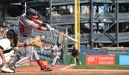 Sep 12, 2021; Pittsburgh, Pennsylvania, USA;  Washington Nationals center fielder Lane Thomas (28) hits a three run home run against the Pittsburgh Pirates during the fourth inning at PNC Park. Mandatory Credit: Charles LeClaire-USA TODAY Sports