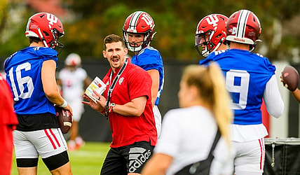 Offensive coordinator Walt Bell demonstrates the proper position during the first open practice of the 2022 season at the practice facility at Indiana University on Tuesday, August 2, 2022.

Iufb Oc Walt Bell Showing Position