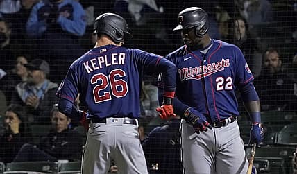 Sep 22, 2021; Chicago, Illinois, USA; Minnesota Twins left fielder Max Kepler (26) is greeted by first baseman Miguel Sano (22) after hitting a home run against the Chicago Cubs during the fourth inning at Wrigley Field. Mandatory Credit: David Banks-USA TODAY Sports