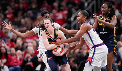 Phoenix Mercury forward Alyssa Thomas (25) attempts to strip the ball from Indiana Fever guard Caitlin Clark (22) on Monday,