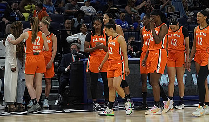 Jul 10, 2022; Chicago, Ill, USA; Players wear the number 42 to honor Brittany Griner as they greet Cherelle Griner (left) Brittany   s spouse during the second half in a WNBA All Star Game at Wintrust Arena. Mandatory Credit: David Banks-USA TODAY Sports